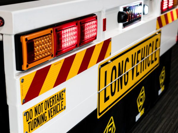 various signs and mudflaps on truck