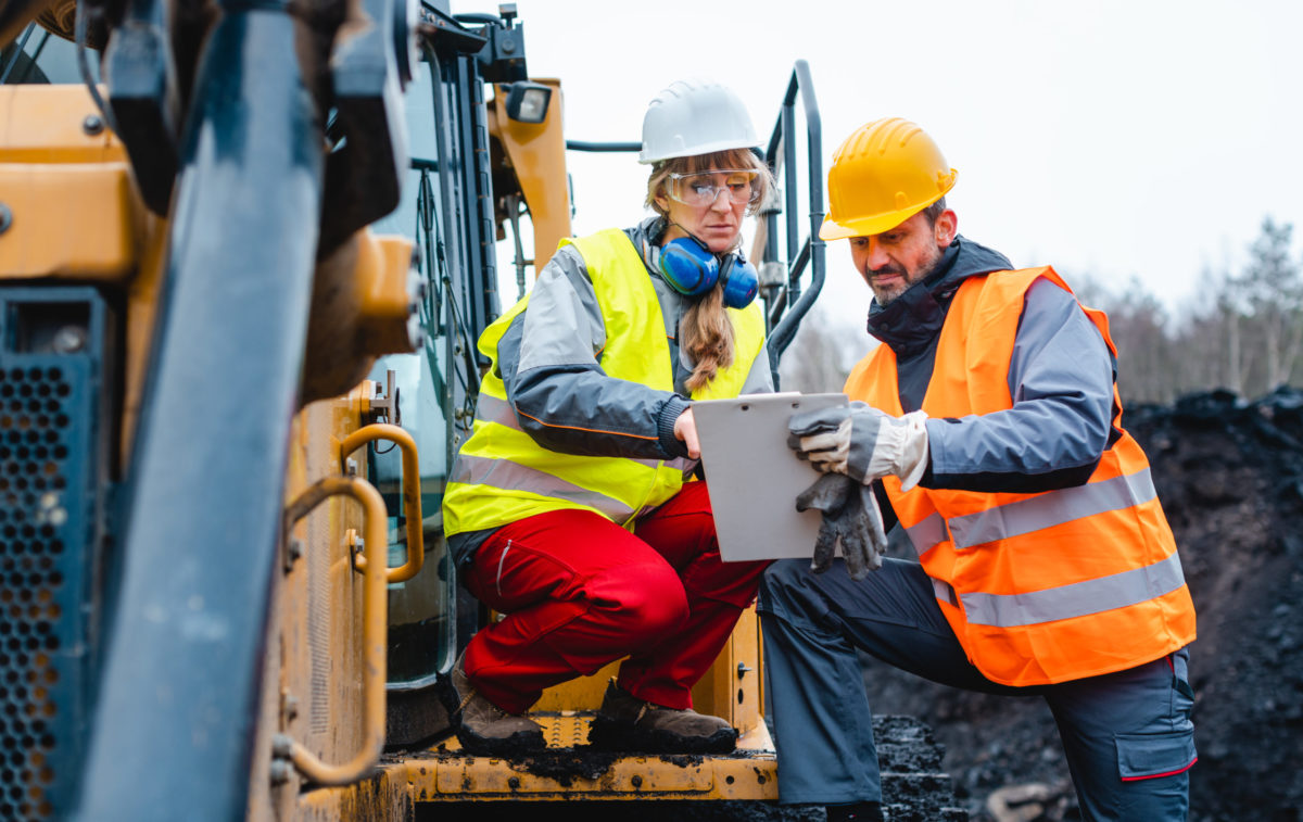 Woman and man worker in quarry