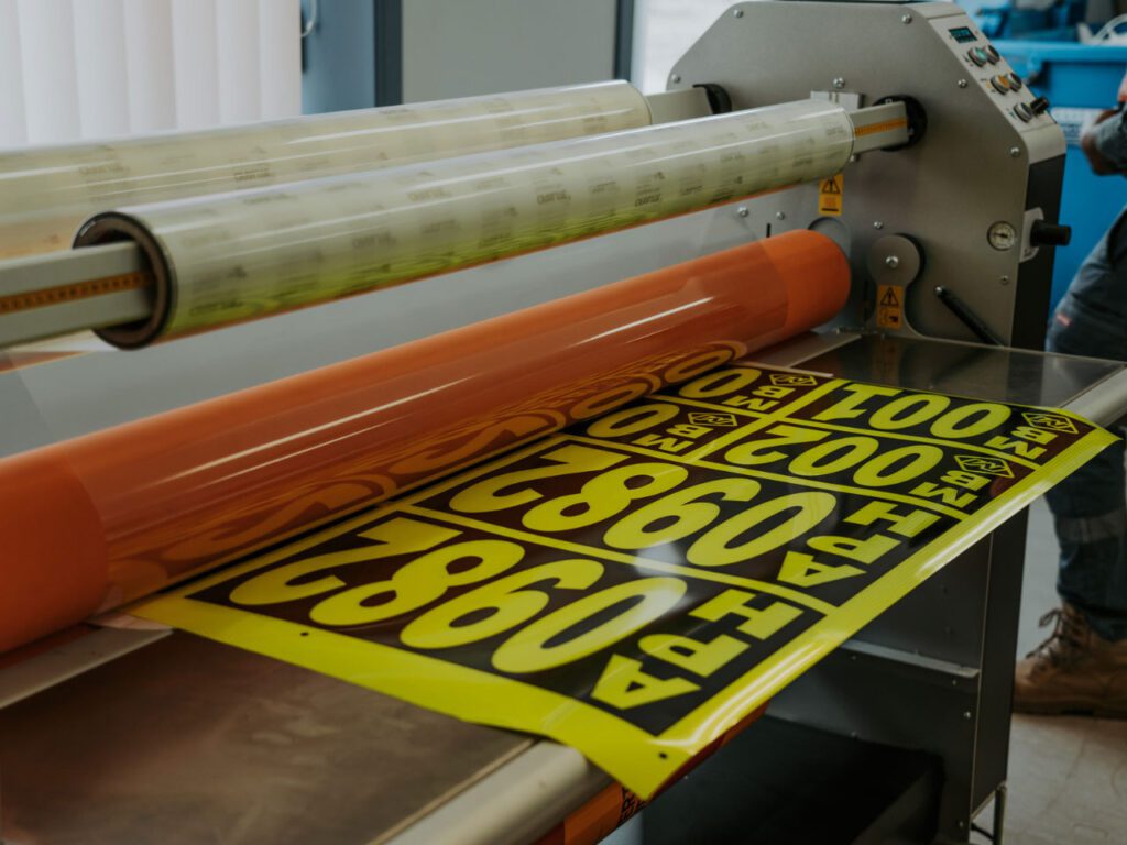 Laminating the stickers for extra protection