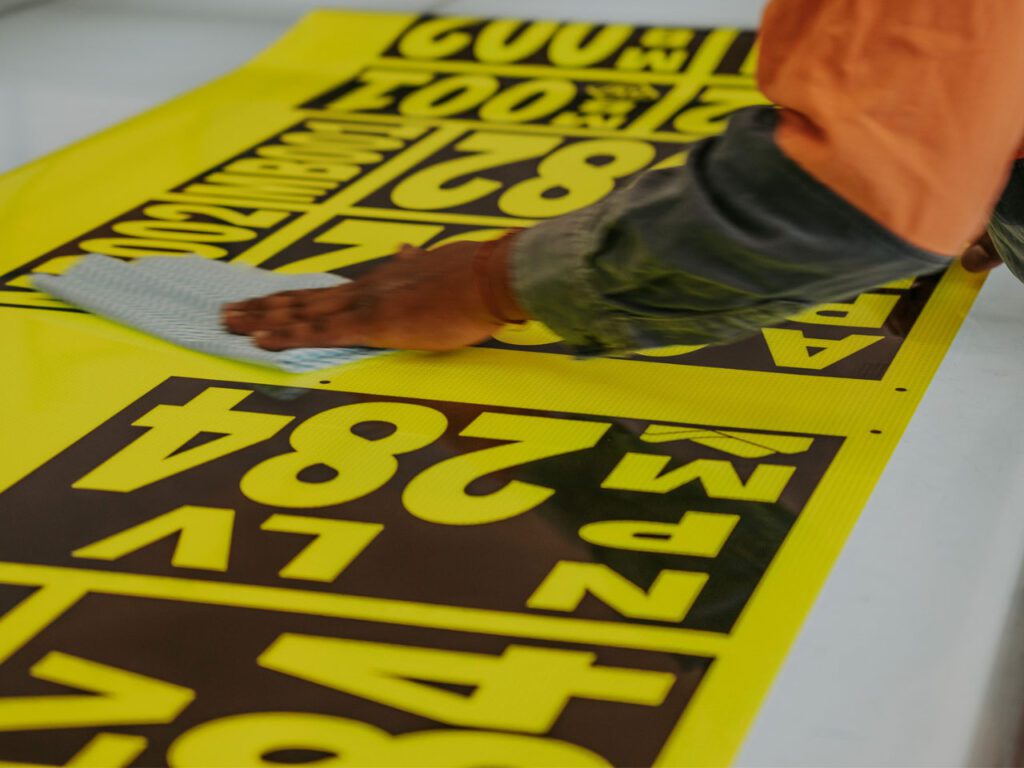 Wiping down the stickers for dust and fingerprints